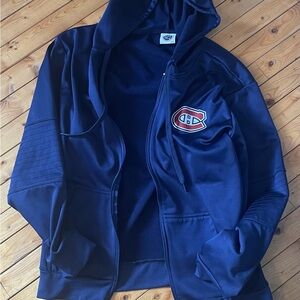 Navy Blue Zip-Up Hoodie with Montreal Canadians logo.